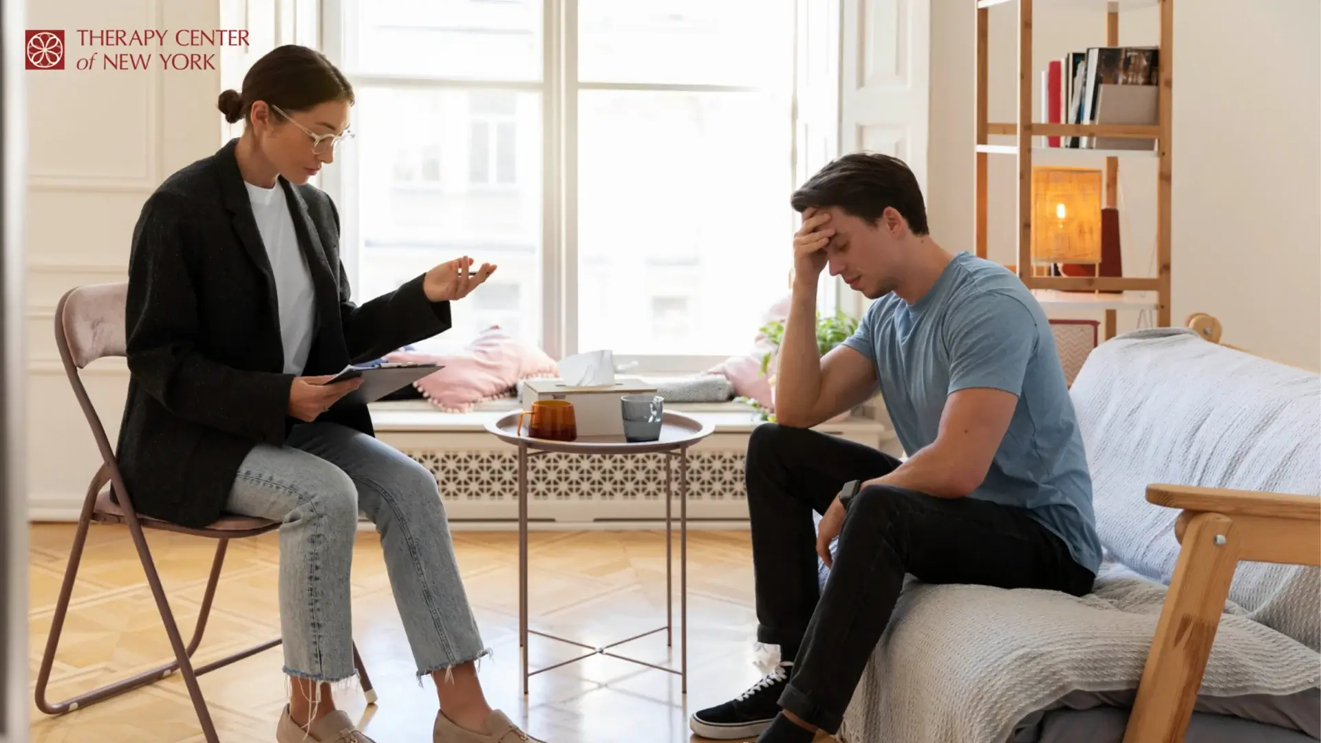 Depression therapy session with therapist helping a man manage stress and negative thoughts in a comfortable setting