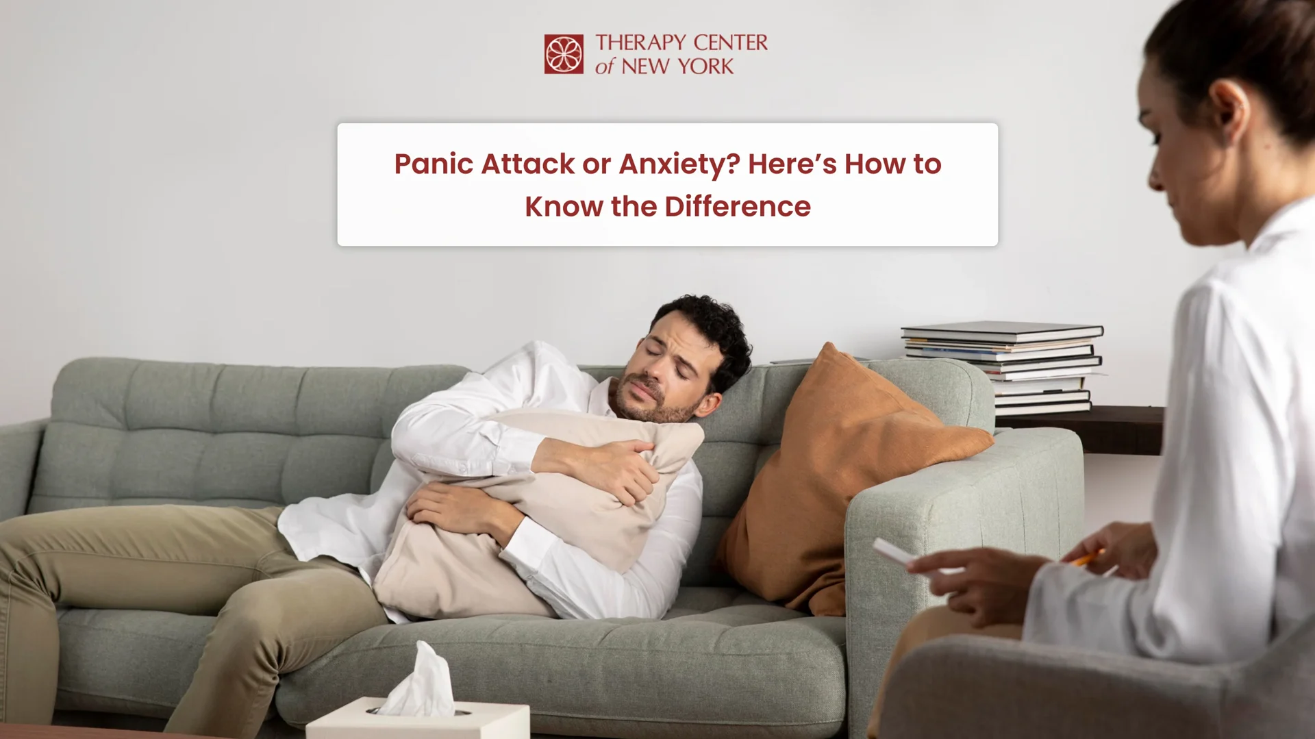 Man experiencing distress on a therapy couch while speaking with a mental health professional about anxiety or panic attacks